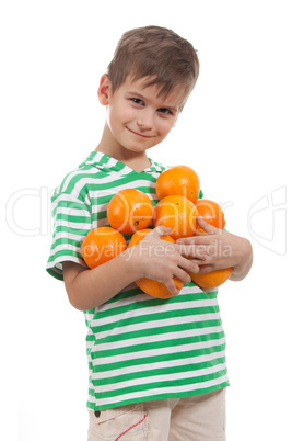 Boy holding oranges