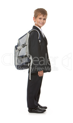 Schoolboy sitting on books