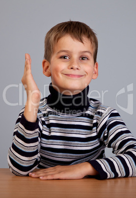 Cheerful Schoolboy ready to answer question