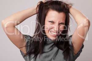 happy young attractive woman holding her hair