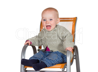 Distressed tearful baby in highchair