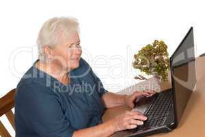Senior lady working on a laptop