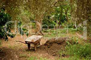 Wheel Barrow Next To Soil Heap