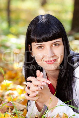 portrait of a beautiful young woman in autumn forest