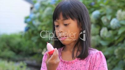 Cute Asian Girl Licking Her Popsicle