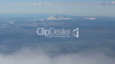 Aerial View Of Mount Baker Slipping Beneath Clouds