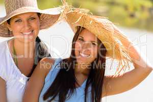 Mother and daughter relaxing outdoors summer teen