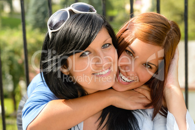 Daughter hugging her mother outdoors happy loving