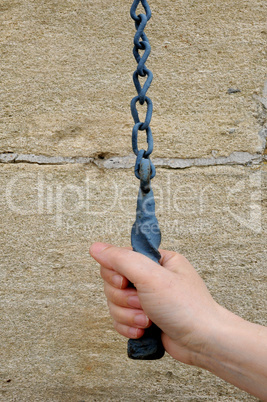 close up of a hand which ring a bell