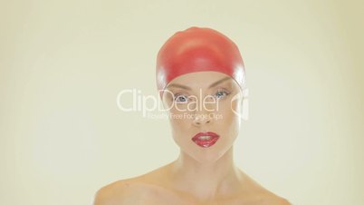 Attractive woman removing her bathing cap
