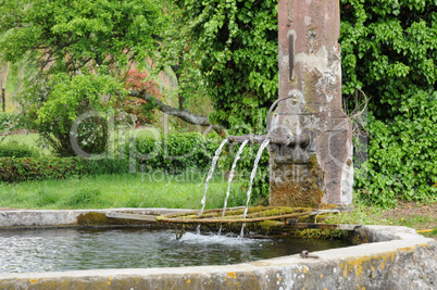 Alsace, a picturesque old fountain in Hunawihr