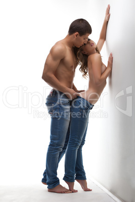 Athletic beauty man and sexy girl posing topless