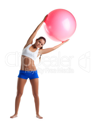 Young girl stand with fitness ball isolated