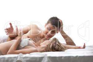 Couple lovers talk and smile in bed