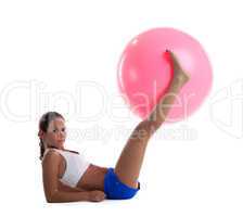 woman lay and take fitness ball with legs