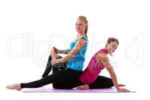 two young woman doing stretch exercise isolated