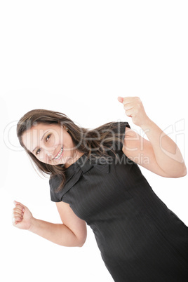 Woman with orthodontics enjoying success with clenched fists