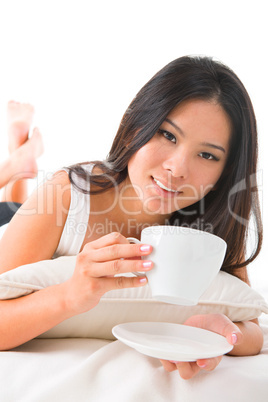 Drinking coffee on bed