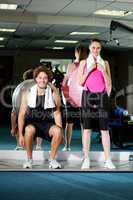 Gym friends working out with the exercise ball
