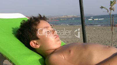 Little boy sunbathing