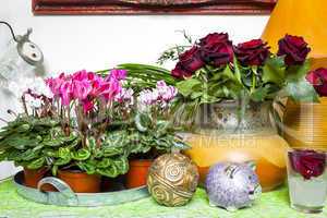 pink cyclamen and red roses