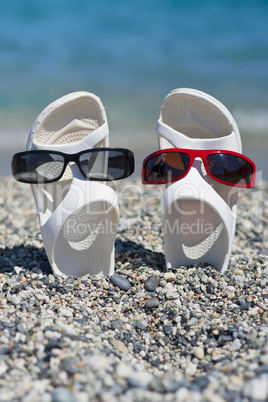 two funny sandals on the beach