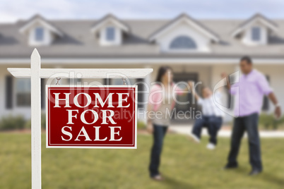 Real Estate Sign and Hispanic Family in Front of House