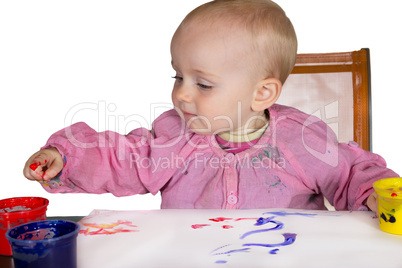 Cute baby experimanting with paint