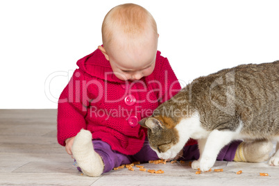 Baby girl with the family cat