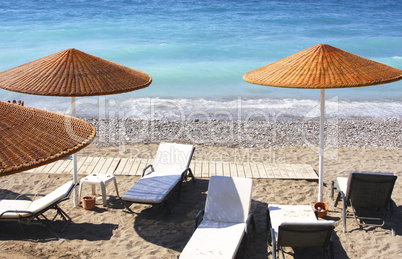 Beach chairs and umbrellas