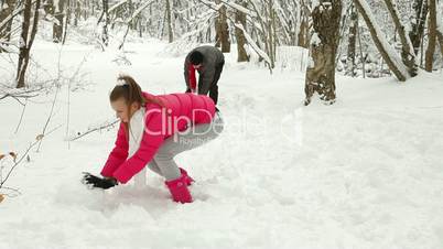 Young Couple Enjoying in Snow and Winter