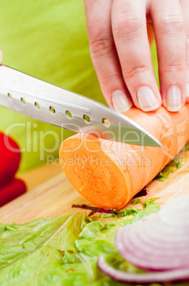 Woman's hands cutting vegetables