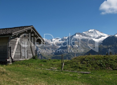 Mountains And Old Shed With Timber Roof