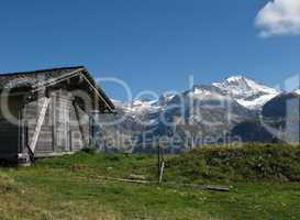Mountains And Old Shed With Timber Roof