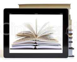 Books and tablet computer isolated on white