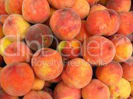 Many bright tasty peaches