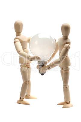two dolls holding a light bulb