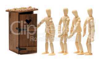 wooden dolls waiting for toilet