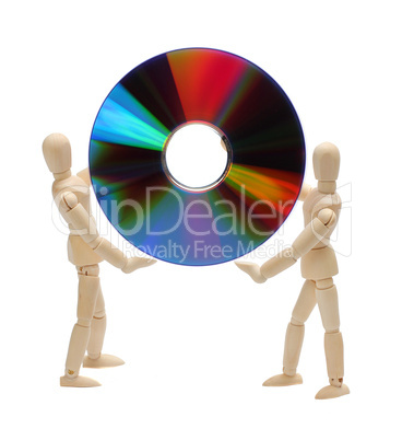 wooden dolls holding a cd