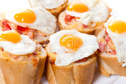 Baguette Slice with Ham and Fried Quail Egg