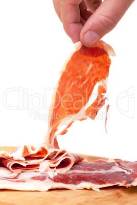 Thinly Sliced ??Spanish Jamon with a Hand