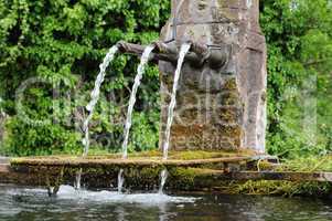 Alsace, a picturesque old fountain in Hunawihr