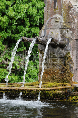 Alsace, a picturesque old fountain in Hunawihr