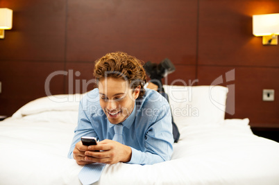 Excited young man waiting for message reply