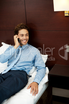 Relaxed cool guy talking on the phone