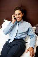 Businessman attending personal calls after work
