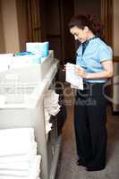 Housekeeping executive folding the hand towel