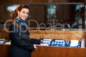 Front office female assistant checking customer records