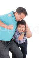 Young boy being aggressively held up by his father