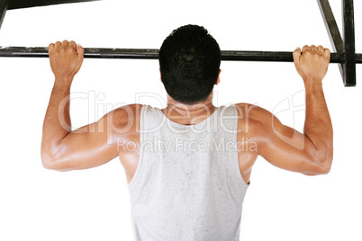 very power athletic guy, execute exercise tightening on horizont